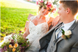 Bride and Groom Seated on Bench Outdoors